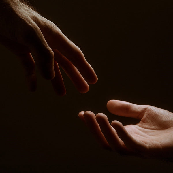 Hands reaching out to each other
