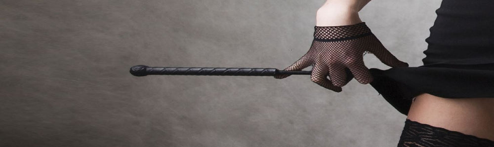 Bondage Play Guides | Model In Bondage Gear With Whip | Bodyjoys