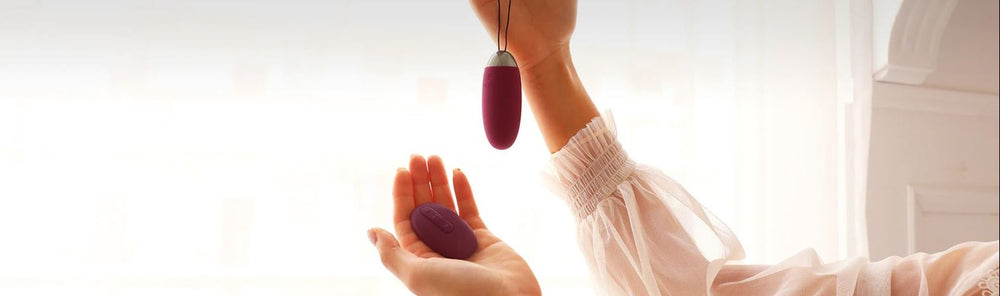 Love Eggs And Kegel Balls Guides | Female Hand Holding Love Egg And Remote | Bodyjoys